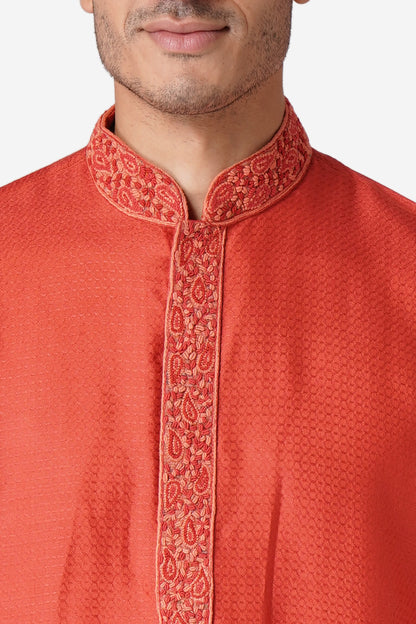 Full Sleeve Self Design Kurta and Churidar Set in Orange Cotton Silk